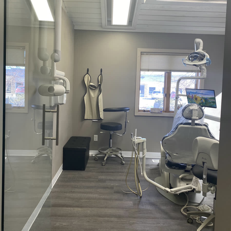 A treatment room at Goose Creek Dental Clinic, chair and monitor under a skylight.